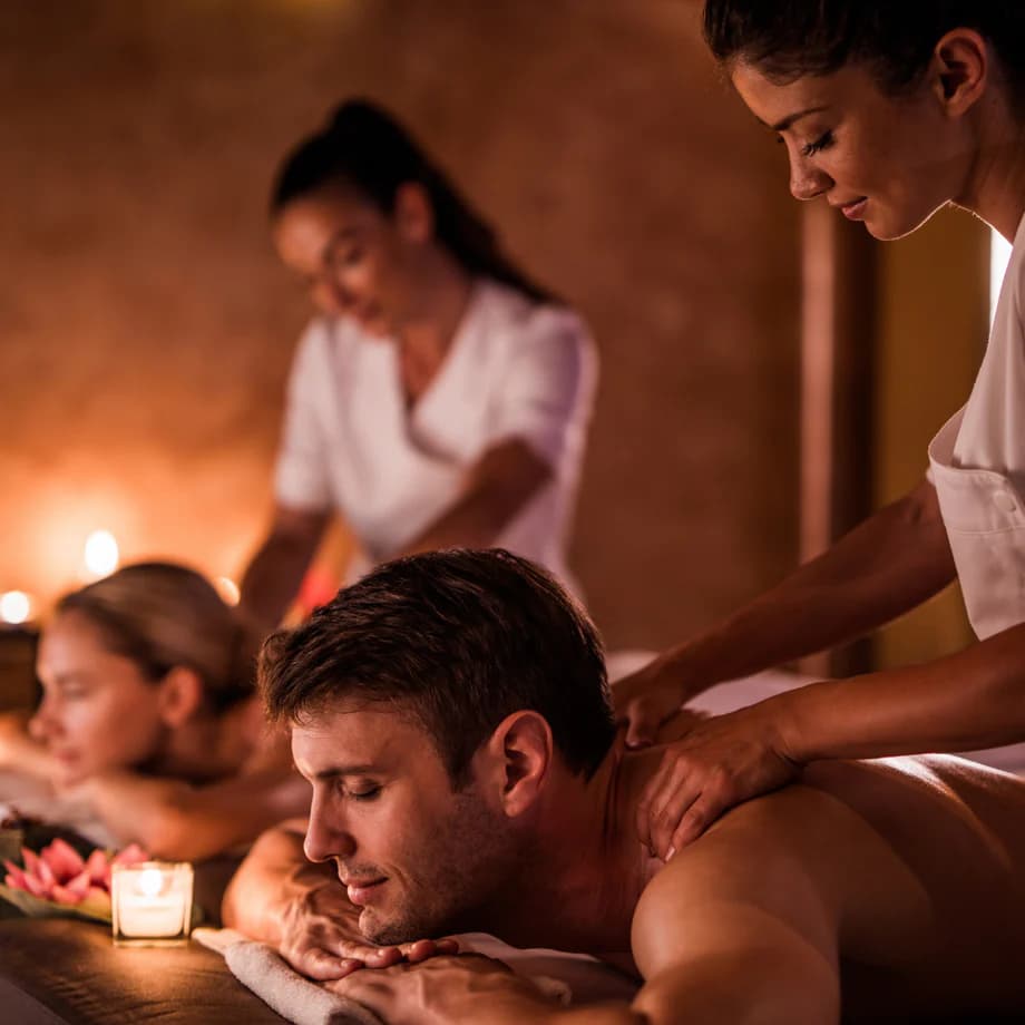 Calm couple enjoying a Club Delight massage treatment